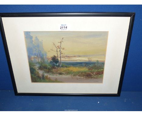 A framed and mounted Watercolour by E.J. Mayberry of a country landscape.