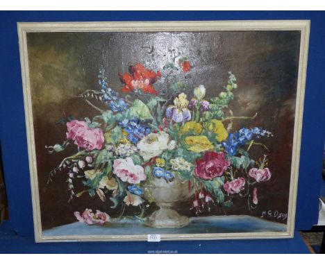 A large oil on canvas depicting a still life of Summer flowers in a vase, signed lower right H.G.Davis, 32 1/4" x 26 3/4".