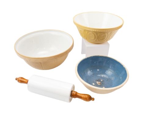 Three traditional stoneware mixing bowls and a ceramic rolling pin