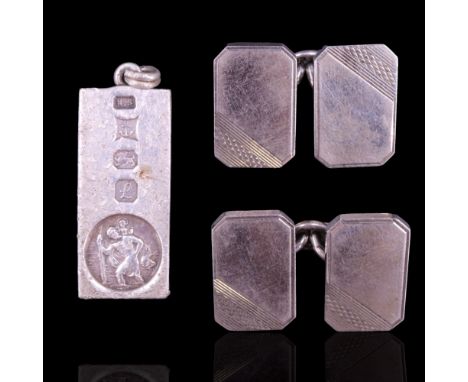A pair of 1950s silver cufflinks, bearing oblique engine-turned decoration, together with a silver St Christoper ingot pendan
