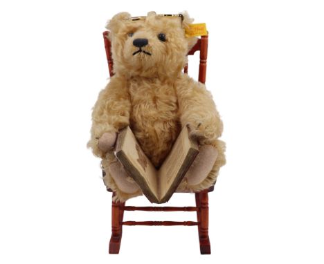A vintage The Steiff Story Book Bear and rocking chair, 654848, 26 cm on chair, (a/f)