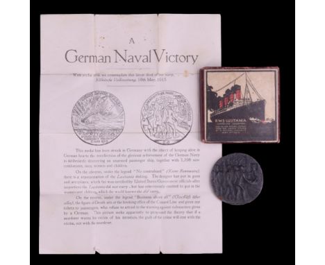 An RMS Lusitania medal in carton together with a related leaflet