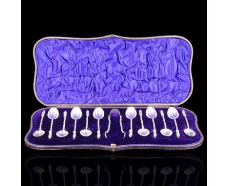 A Victorian cased set of twelve silver apostle teaspoons with sugar tongs, William Hutton and Sons, London, 1898, 170g