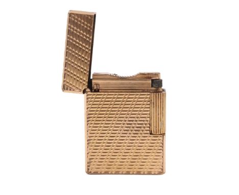 A vintage SJ Dupont gold-plated roller cigarette lighter