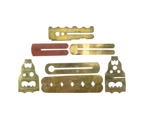 A collection of seven variant Great War - Second World War British Army button sticks / clothing protectors