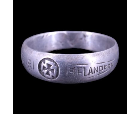 An Imperial German Army soldier's finger ring, inscribed in aluminium alloy and bearing an Iron Cross device with inscription