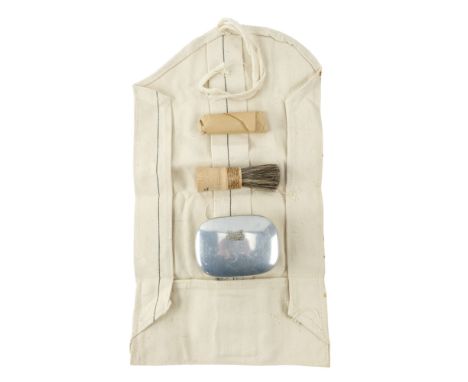 A Second World War British Army personal kit roll, a shaving brush, razor and soap tin