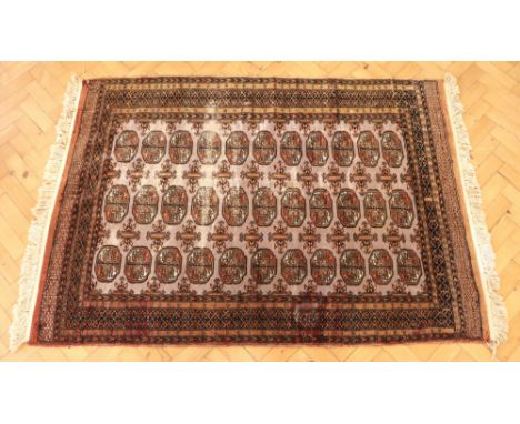 A vintage Bokhara wool-pile rug, 180 x 124 cm