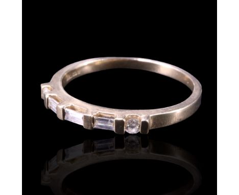 A diamond-set band, comprising three baguette-cut stones of approx 0.4 cts aggregate weight, bar-set between two brilliants o