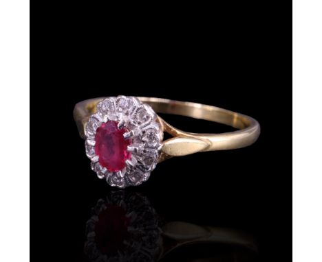 A ruby and diamond cluster ring comprising a central oval-cut ruby of approx 0.35 cts, claw-set above a petal-like arrangemen