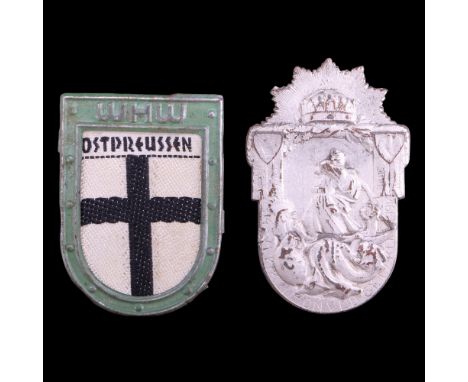 An Imperial Austrian Army tradition badge together with a German Third Reich Winterhilfswerk OstPreussen badge