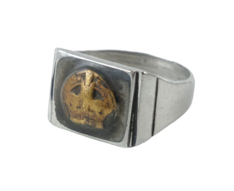 A Great War trench art finger ring incorporating a brass crown device