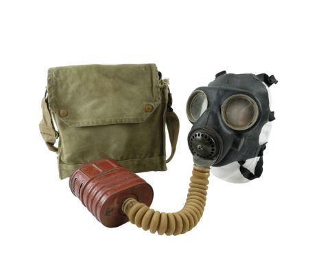 A Second World War British army gas mask and haversack