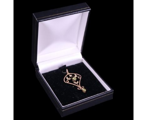 An early 20th Century peridot and seed pearl openwork 9 ct gold pendant, 41 cm x 25 cm excluding bale, 2.6 g