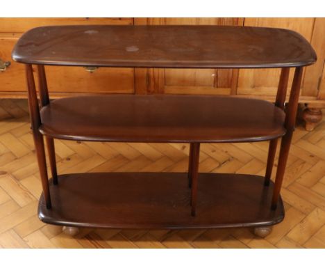 A vintage Ercol ‘Baby Giraffe’ trolley bookcase
