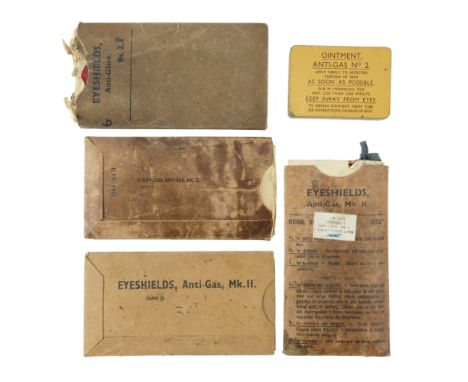 A Second World War British Army Anti-Gas Ointment No 2 kit together with four cartons of anti-gas eyeshields