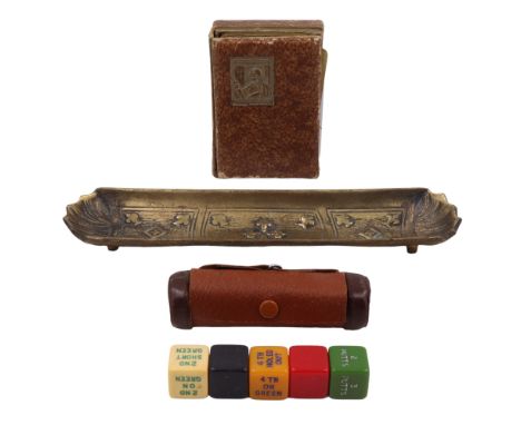 A pack of vintage Waddingtons playing cards together with a set of games dice in a hide case and a brass dish decorated in de