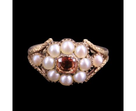 A Victorian orange topaz and pearl flowerhead cluster locket ring comprising a central rectangular cushion-cut topaz, millegr