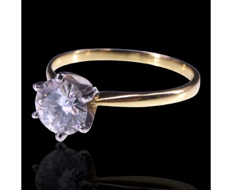 A solitaire diamond ring, comprising a cathedral-set stone of approx 0.9 cts, set on 18 ct gold, R, 2.6 g