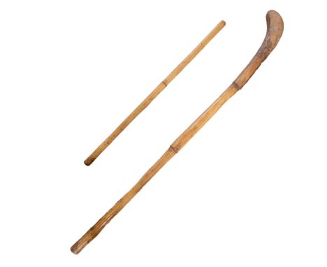 A bamboo cane swagger stick together with a similar club / hockey type stick, former 62 cm 