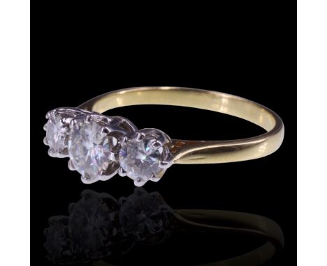 A three-stone moissanite ring, comprising a central brilliant-cut stone of approx 0.9 cts, between two smaller stones of appr