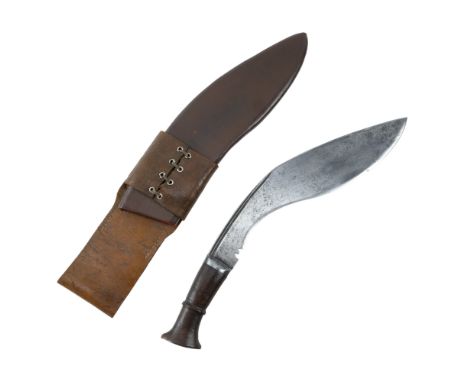 A British / Indian military kukri, its blade stamped "M / L", in brown leather covered wooden scabbard with riveted frog fast