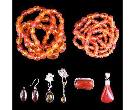 Two vintage amber bead necklaces together with a pair of contemporary white metal and sun-spangled amber ear pendants, a pend