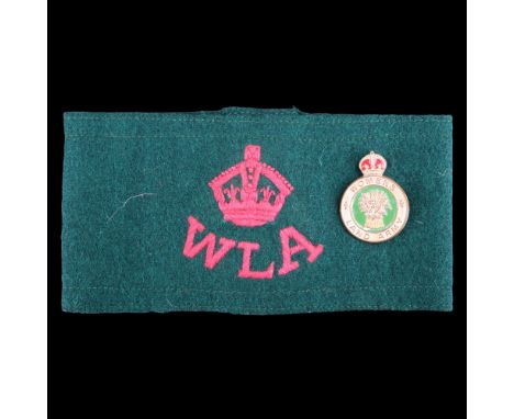 A Second World War British Home Front Women's Land Army arm band and cap badge