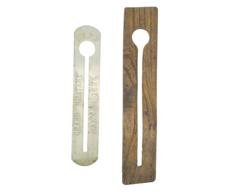 A Victorian British Rifle Volunteer's engraved button stick together with a wooden clothing protector