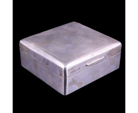 A 1940s silver table cigarette box, the hinged lid engine turn decorated and centred by an engraved "R" armorial, Mappin &amp