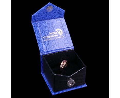 A contemporary spessartine ring comprising five graduated stones set on a two-colour 9 ct yellow metal shank, P, 2.3 g