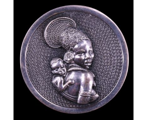 A late 20th Century South African Candida Sterling white metal brooch, of concave circular form decorated with a high-relief 