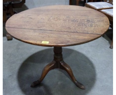 A 19th century oak snap-top tripod table. 32' diam.