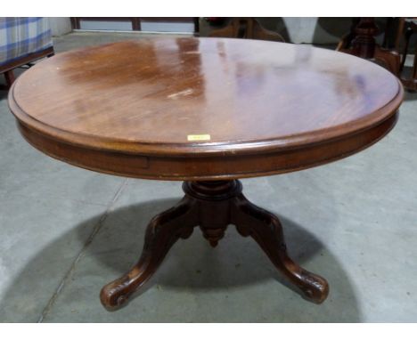 A Victorian mahogany snap-top supper table on tripod support. 39' diam