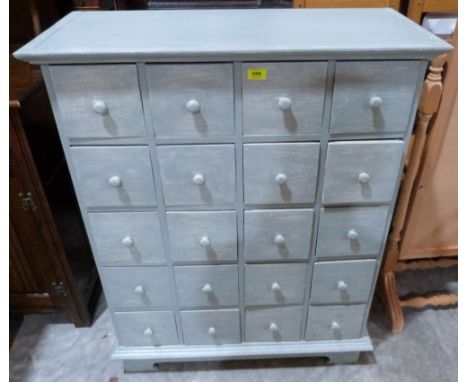 A painted chest with an arrangement of twenty drawers, raised on bracket feet. 34' wide 