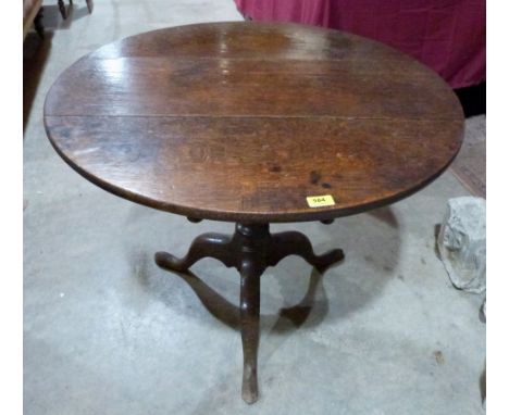 A George III oak snap-top tripod table. 32½' diam