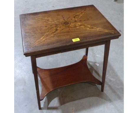 An Edward VII mahogany card table with green baize lined fold-over marquetry inlaid top. 21½' wide