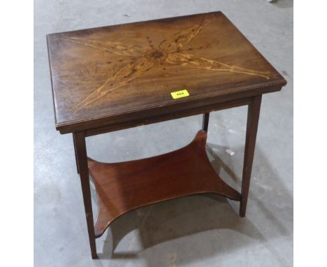 An Edward VII mahogany card table with green baize lined fold-over marquetry inlaid top. 21½' wide