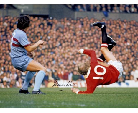 Autographed DENIS LAW 1971 MAN UNITED 16 x 12 Photo showing a wonderful image of the Manchester United striker having a pop a