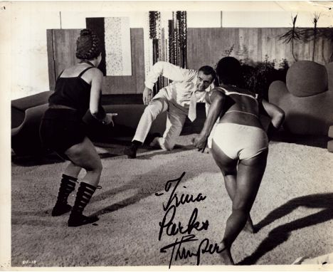 Trina Parks signed 10x8 inch vintage James Bond black and white photo. Good condition. All autographs come with a Certificate