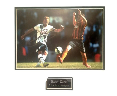 Harry Kane signed 18x17 inch overall mounted colour photo pictured in action for Tottenham Hotspur. Good condition. All autog