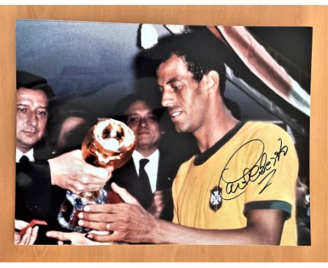 Football, Carlos Alberto Torres signed 16x12 colour photograph pictured as he receives the 1970 Jules Rimet Trophy as Brazil'