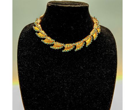 Beautiful gold-tone spray and wave shapes with light blue rhinestone accents and hook clasp. Dimensions: 16.75"LCondition: Go