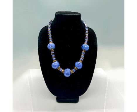 Blue ceramic beads with brass spacers and hook clasp. Dimensions: 24"LCondition: Good, minor age related wear.High Res Image 