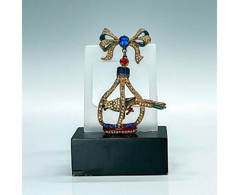 This Art Deco unsigned pin is fabulous, featuring a trembling parrot perched in a cage which is set with tiny pave rhinestone