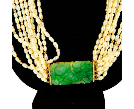 Stunning 10 strand beaded necklace with a marked 18K yellow gold carved jade pendant . Measures approx. 17"L, pendant is 2"x 