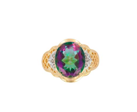 An absolutely stunning ladies statement ring with a large oval mystic topaz that is 14.12mm x 11.90mm and weights 7ctw, surro