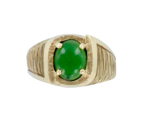 Beautiful vintage Art Deco style ring in 10K yellow gold with an oval green jade in the center. Weight 8.7 grams. Size 10.5. 