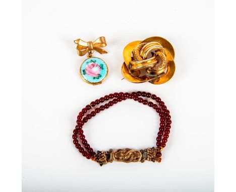 Grouping includes: Ruby red garnet stones double strand bracelet with Art Nouveau closure (7" full length), floral design bro