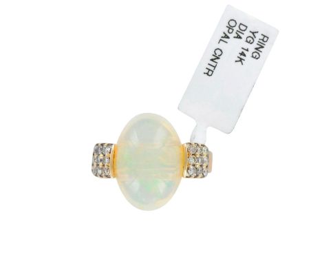 An elegant ladies ring for a special occasion or an everyday wear in style. Central stone is a large beautiful oval opal 7.20